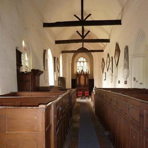 Interior St James Church. Limewash walls and very high pews. The organ dates to 1864.