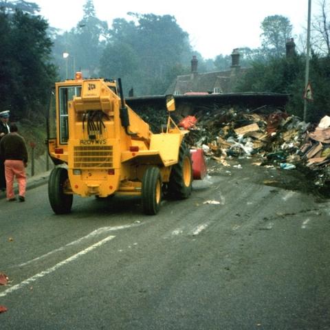 Roydon Road Stanstead Abbotts. Yet another calamity at the bottom of Cats Hill. After many hours the trailer was finally turned upright and reloaded. The lorry went another 100 yards and then stalled. A breakdown team finally managed to restart it. Photo about 1980 ?