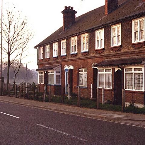 These cottages still remain but the farm land to their right is now houses. Roydon Road around 1980.