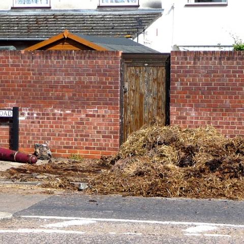 Trailer load of manure spills on to the Roydon Road. Another bollard uprooted. April 19th 2011