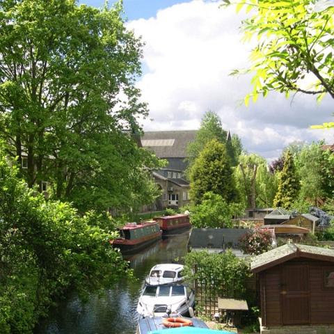 The Mill stream, bottom of Glenmire Terrace. Once used to convey cargo to the malt industry in the village. Now a quiet backwater. Photo 2005.