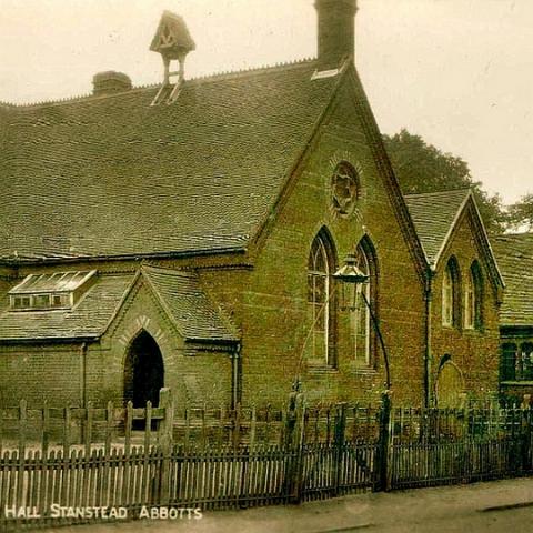 Stanstead Abbotts school. Note the bell on the roof, where did it go? Dates to 1918 or earlier due to postage rate on card.